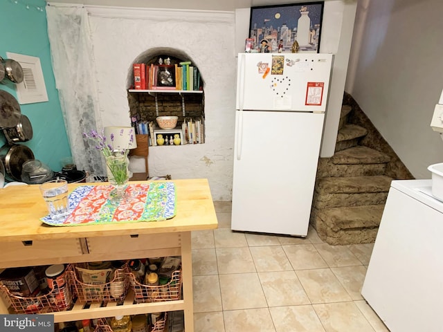 316-322 W Wildey St, Philadelphia, PA 19123 - kitchen with freestanding refrigerator, tile patterned floors, and washer / dryer