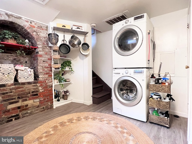 316-322 W Wildey St, Philadelphia, PA 19123 - washroom with stacked washer / dryer and wood finished floors