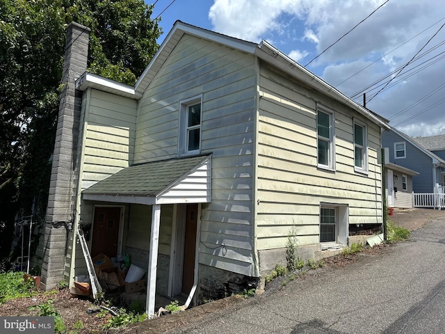 219 E Pike St, Bellefonte, PA 16823 - view of property exterior with a chimney