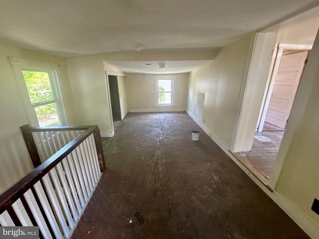 219 E Pike St, Bellefonte, PA 16823 - hallway featuring baseboards and an upstairs landing