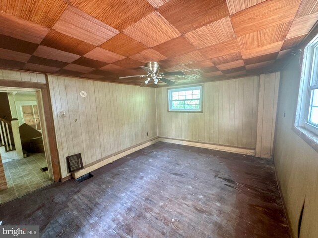 219 E Pike St, Bellefonte, PA 16823 - unfurnished room with wood walls, wood finished floors, and a ceiling fan