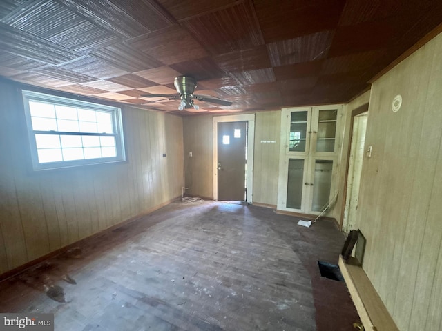219 E Pike St, Bellefonte, PA 16823 - unfurnished room featuring wood walls and a ceiling fan