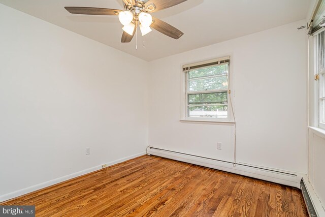 1916 Porter Ave, Suitland, MD 20746 - spare room with a baseboard radiator, wood finished floors, and ceiling fan