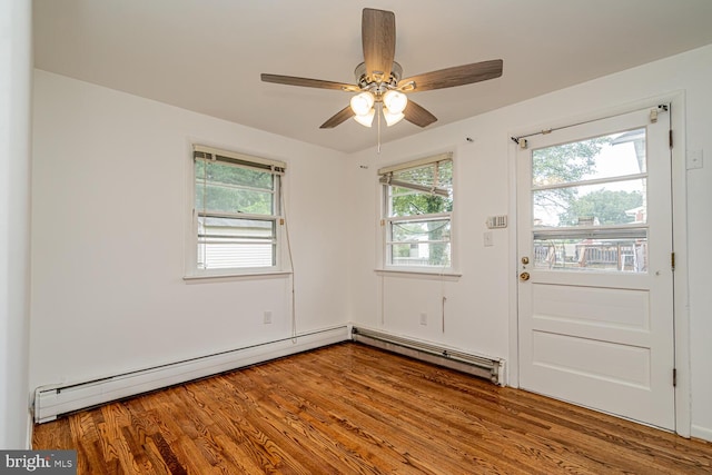 1916 Porter Ave, Suitland, MD 20746 - empty room featuring plenty of natural light, wood finished floors, and a ceiling fan