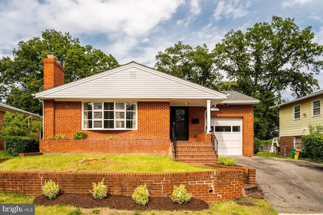 1916 Porter Ave, Suitland, MD 20746 - view of front of home featuring a garage, a chimney, driveway, and brick siding