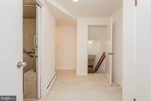 1916 Porter Ave, Suitland, MD 20746 - corridor featuring baseboard heating and an upstairs landing