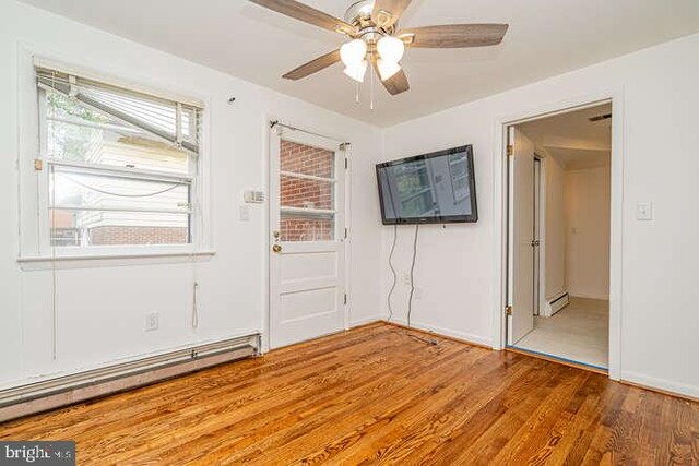 1916 Porter Ave, Suitland, MD 20746 - entryway featuring a baseboard radiator, a ceiling fan, wood finished floors, and a baseboard heating unit