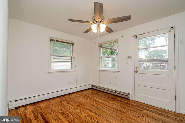 1916 Porter Ave, Suitland, MD 20746 - spare room featuring healthy amount of natural light, a ceiling fan, wood finished floors, and baseboard heating