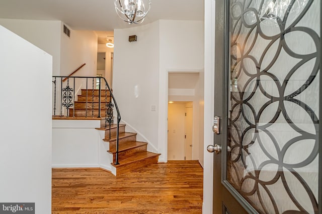 1916 Porter Ave, Suitland, MD 20746 - foyer entrance with stairway, wood finished floors, and a chandelier