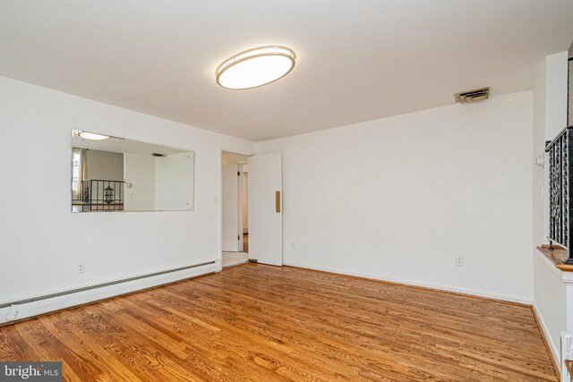 1916 Porter Ave, Suitland, MD 20746 - spare room featuring baseboard heating and wood finished floors