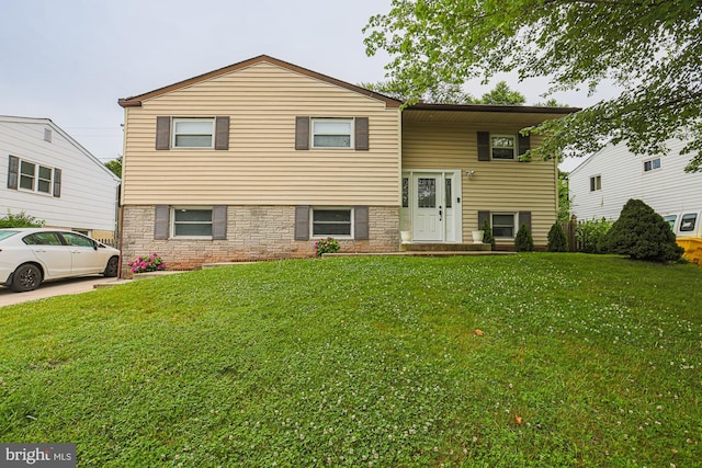 8935 Twin Ridge Dr, Glen Burnie, MD 21061 - split foyer home with a front yard and stone siding