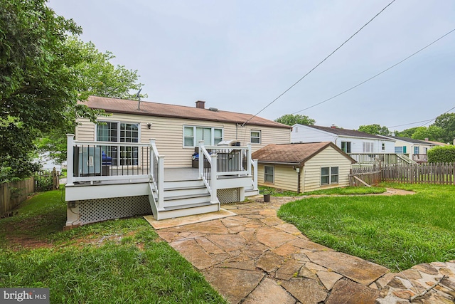 8935 Twin Ridge Dr, Glen Burnie, MD 21061 - rear view of house featuring a fenced backyard, an outdoor structure, and a wooden deck