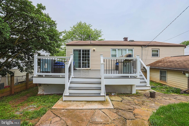 8935 Twin Ridge Dr, Glen Burnie, MD 21061 - rear view of house featuring a deck, stairs, and a chimney