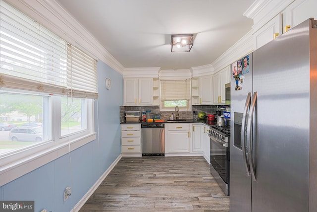 8935 Twin Ridge Dr, Glen Burnie, MD 21061 - kitchen with appliances with stainless steel finishes, open shelves, dark countertops, white cabinetry, and tasteful backsplash
