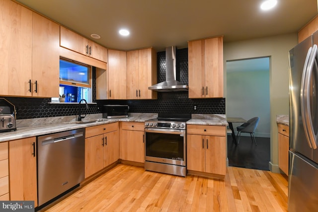 513 N E Ave, Wenonah, NJ 08090 - kitchen featuring appliances with stainless steel finishes, wall chimney exhaust hood, light brown cabinets, light wood-type flooring, and recessed lighting