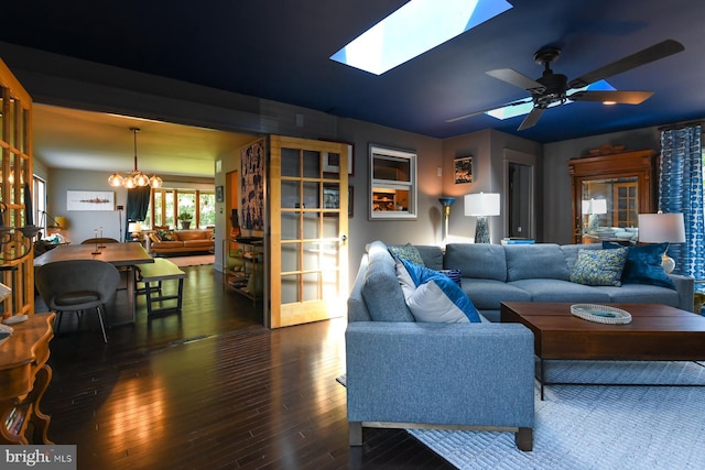 513 N E Ave, Wenonah, NJ 08090 - living area with wood-type flooring, ceiling fan, a skylight, and a chandelier