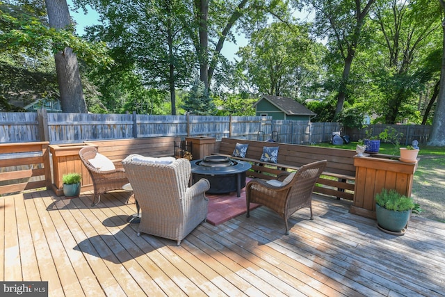 513 N E Ave, Wenonah, NJ 08090 - deck with an outdoor fire pit, a fenced backyard, and view of wooded area