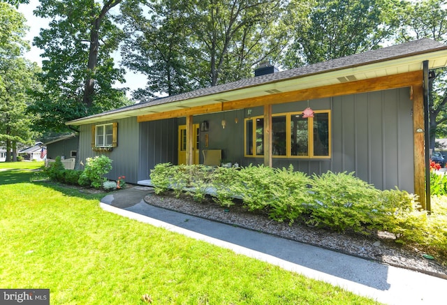 513 N E Ave, Wenonah, NJ 08090 - rear view of property with a lawn, board and batten siding, and a chimney