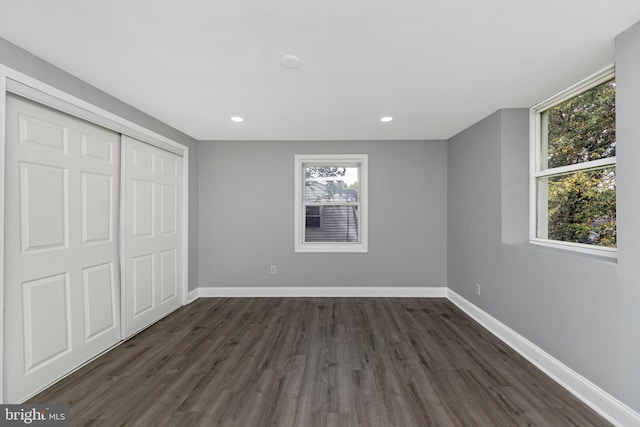 7702 Burnside Rd, Landover, MD 20785 - unfurnished bedroom featuring dark wood-style floors, a closet, and recessed lighting