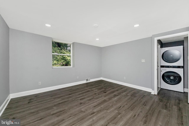 7702 Burnside Rd, Landover, MD 20785 - laundry area with estacked washer and dryer, dark wood finished floors, and recessed lighting