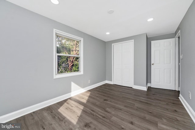 7702 Burnside Rd, Landover, MD 20785 - unfurnished bedroom with dark wood-type flooring, a closet, and recessed lighting
