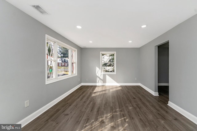 7702 Burnside Rd, Landover, MD 20785 - empty room featuring plenty of natural light, dark wood-type flooring, and recessed lighting