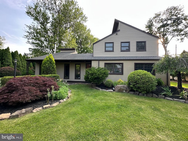 607 Cembra Ct, Feasterville Trevose, PA 19053 - view of front facade featuring a front lawn, a shingled roof, and stucco siding