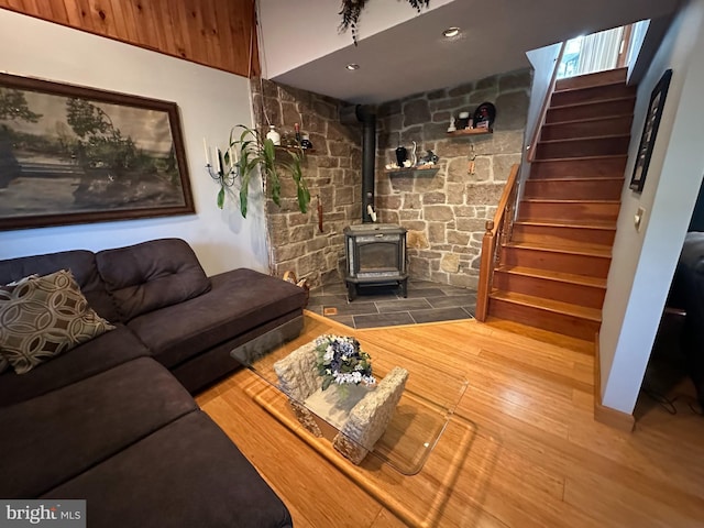 607 Cembra Ct, Feasterville Trevose, PA 19053 - living area featuring stairway, a wood stove, and wood finished floors