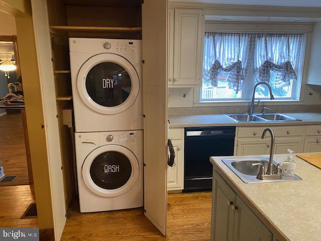 21 Willow St, Milroy, PA 17063 - washroom with stacked washer / drying machine and light wood-style floors