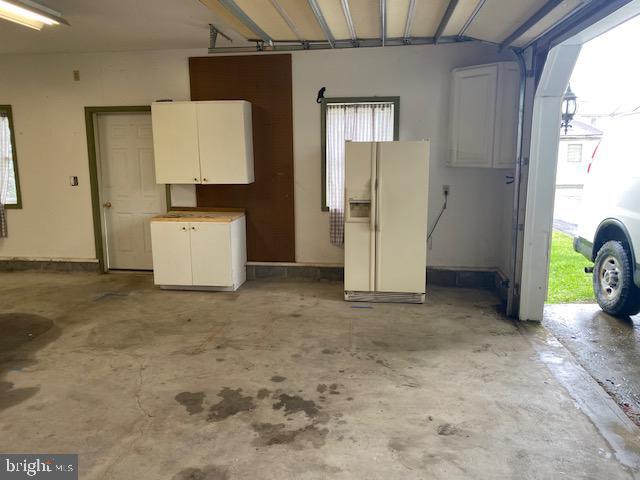 21 Willow St, Milroy, PA 17063 - garage featuring white refrigerator with ice dispenser