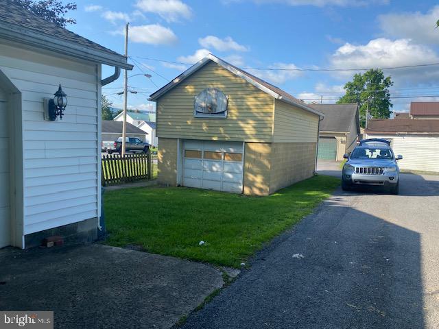 21 Willow St, Milroy, PA 17063 - view of side of property featuring asphalt driveway and an outdoor structure