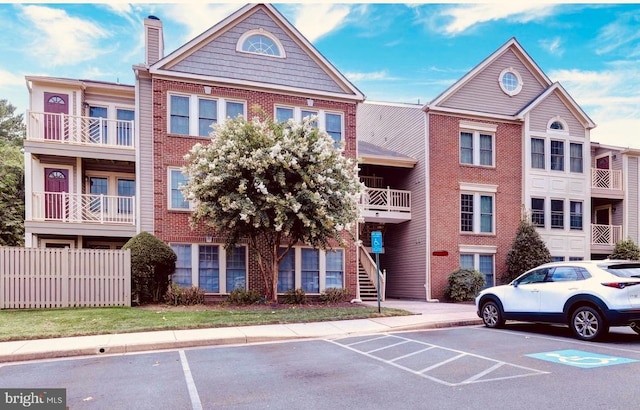12012 Ridge Knoll Dr Unit 7, Fairfax, VA 22033 - view of property with uncovered parking and stairway