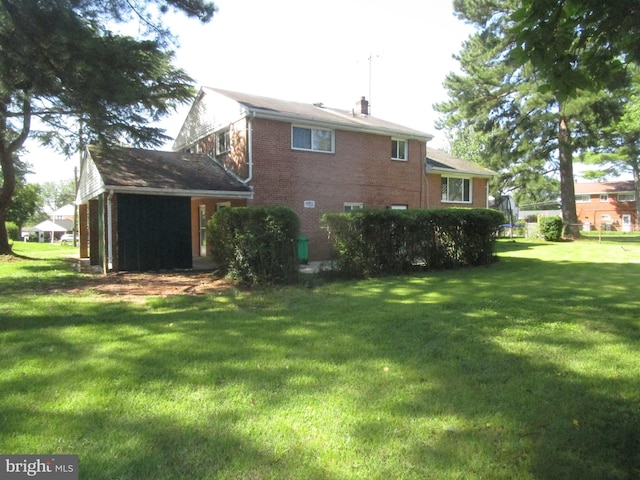 5606 Devon Ct, Temple Hills, MD 20748 - back of house featuring a lawn and brick siding