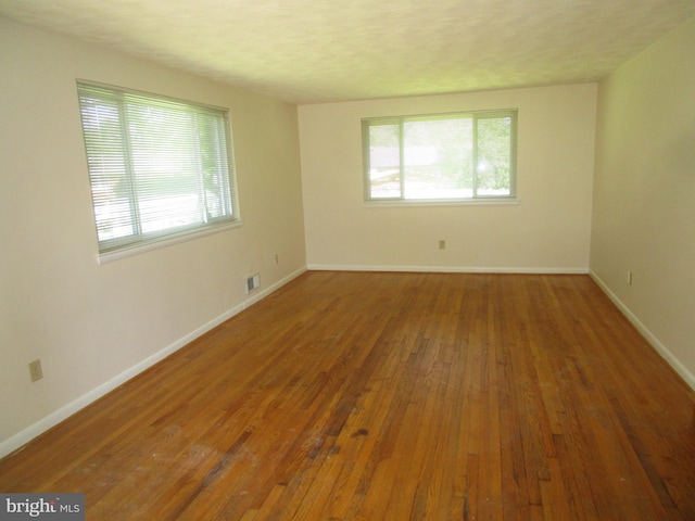 5606 Devon Ct, Temple Hills, MD 20748 - spare room featuring plenty of natural light and hardwood / wood-style floors