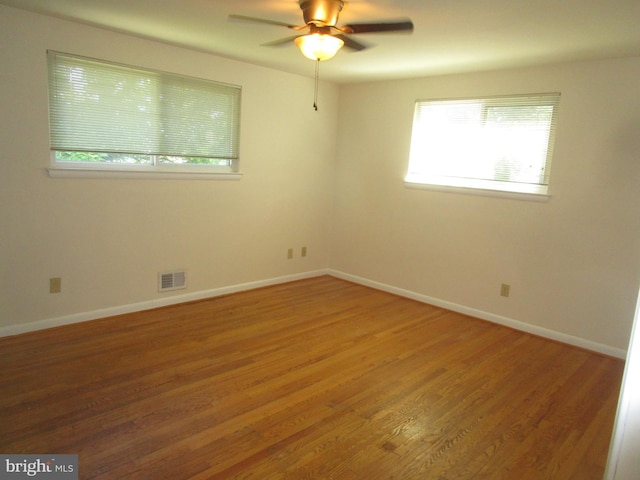 5606 Devon Ct, Temple Hills, MD 20748 - unfurnished room featuring plenty of natural light, light wood-style flooring, and ceiling fan