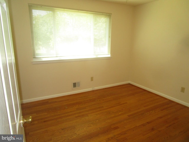 5606 Devon Ct, Temple Hills, MD 20748 - spare room with healthy amount of natural light and wood finished floors