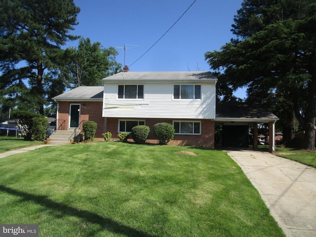 5606 Devon Ct, Temple Hills, MD 20748 - split level home with brick siding, an attached carport, driveway, a front lawn, and a chimney