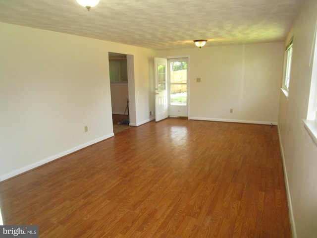 5606 Devon Ct, Temple Hills, MD 20748 - spare room featuring wood finished floors and a textured ceiling