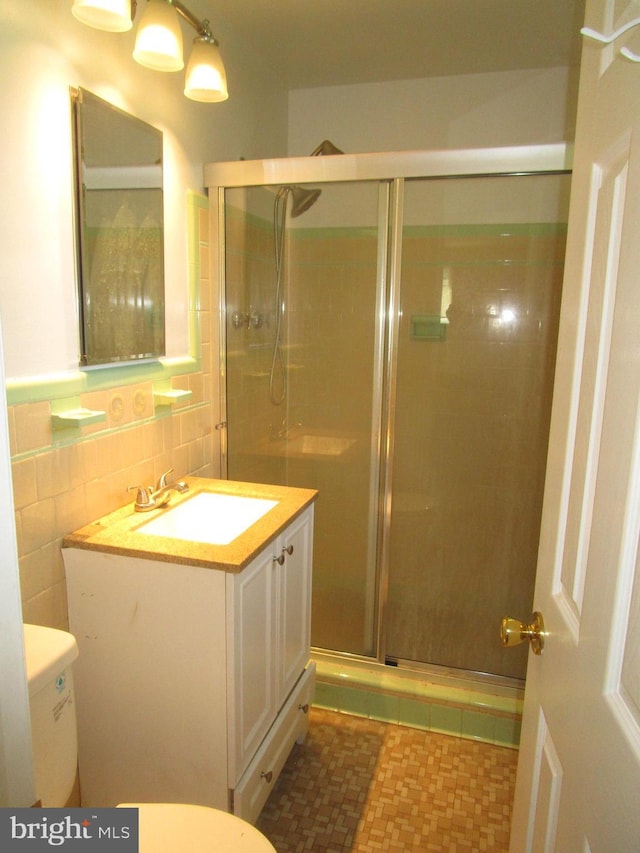 5606 Devon Ct, Temple Hills, MD 20748 - bathroom featuring vanity and a shower stall