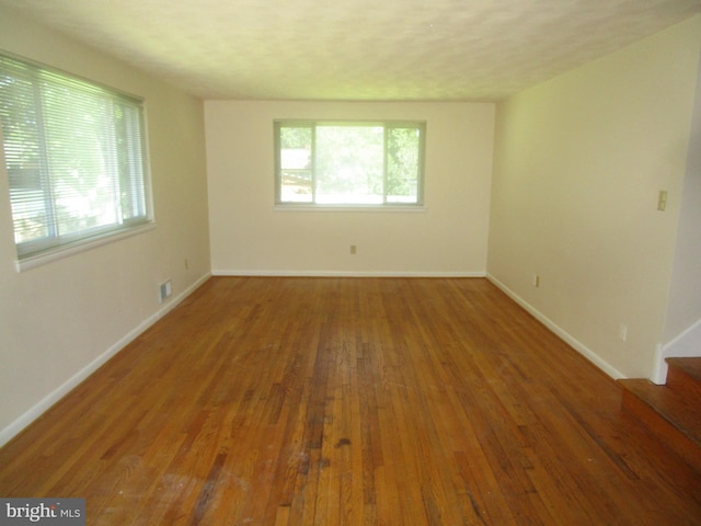5606 Devon Ct, Temple Hills, MD 20748 - unfurnished room featuring wood finished floors and stairs
