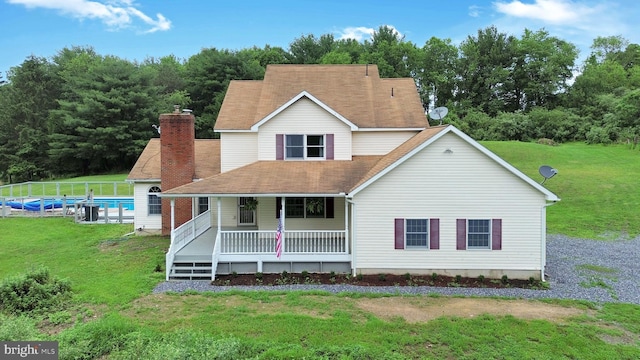 132 Sycamore Dr, Palmerton, PA 18071 - view of front of home featuring a chimney, covered porch, an outdoor pool, and a front lawn