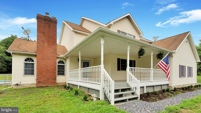 132 Sycamore Dr, Palmerton, PA 18071 - view of front of home with a porch, a chimney, and roof with shingles