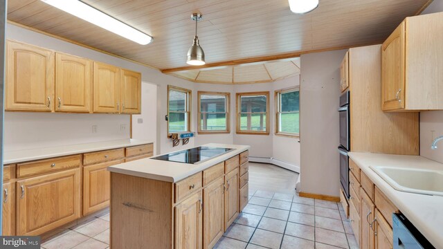 132 Sycamore Dr, Palmerton, PA 18071 - kitchen with black electric stovetop, dishwashing machine, a center island, light brown cabinetry, and light tile patterned flooring