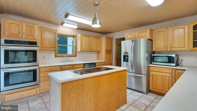 132 Sycamore Dr, Palmerton, PA 18071 - kitchen featuring appliances with stainless steel finishes, a kitchen island, wood ceiling, light countertops, and light tile patterned flooring