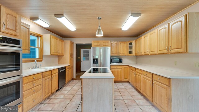 132 Sycamore Dr, Palmerton, PA 18071 - kitchen featuring appliances with stainless steel finishes, a center island, light brown cabinets, glass insert cabinets, and light tile patterned floors