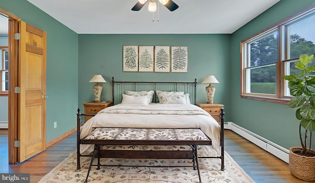 132 Sycamore Dr, Palmerton, PA 18071 - bedroom with baseboard heating, wood finished floors, and ceiling fan