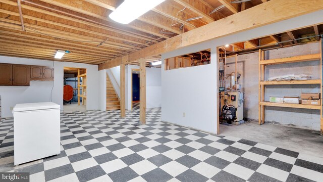 132 Sycamore Dr, Palmerton, PA 18071 - unfinished below grade area featuring refrigerator, light floors, stairs, and a heating unit