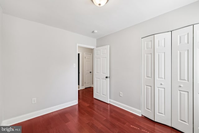 9046 Queen Maria Ct, Columbia, MD 21045 - unfurnished bedroom featuring wood finished floors and a closet