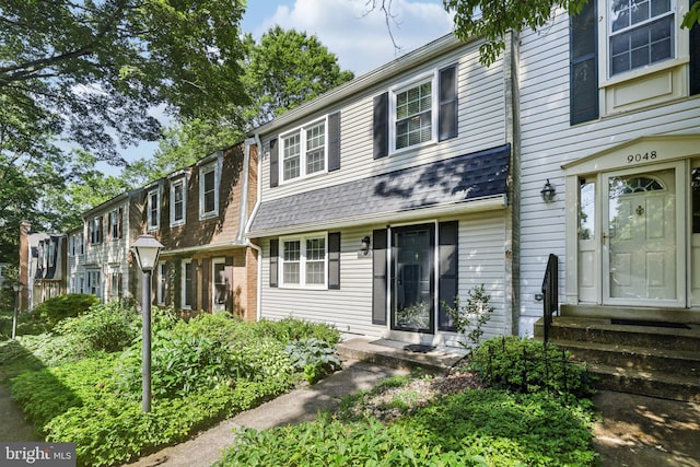 9046 Queen Maria Ct, Columbia, MD 21045 - townhome / multi-family property with entry steps and roof with shingles