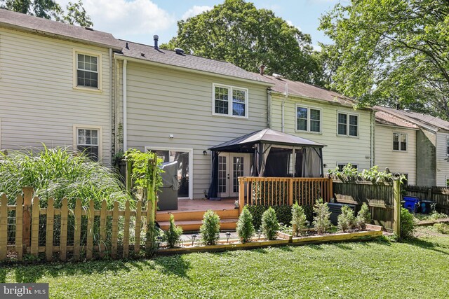9046 Queen Maria Ct, Columbia, MD 21045 - back of house with a gazebo, a deck, french doors, and a vegetable garden